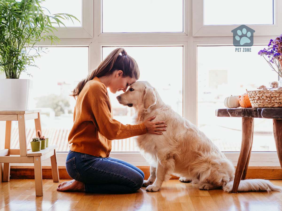 woman touching noses with dog