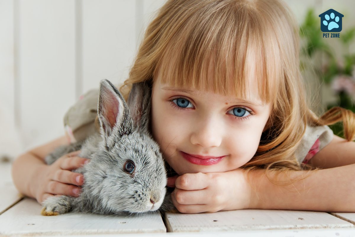 little girl hugging her rabbit